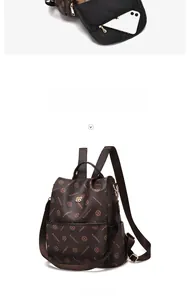 Detail view showing internal storage capacity of brown printed faux leather backpack