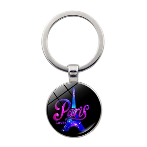 Detail of silver Eiffel Tower keychain featuring Paris Lover text on star sky pendant