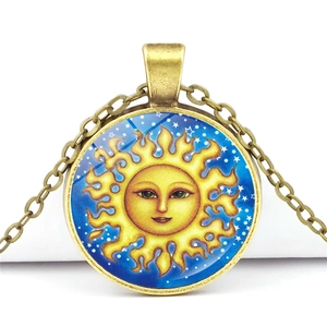 Vintage sun face glass gem pendant necklace with bronze alloy chain on white background