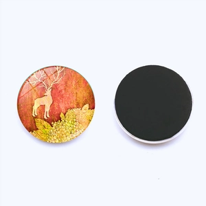 Detail of Christmas elk glass fridge magnet showing vintage design and magnetic back