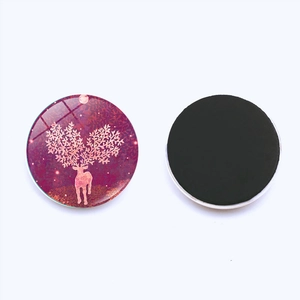 Detailed view showing the glass front and magnetic back of a 25mm Christmas deer magnet