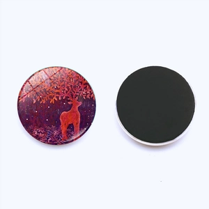 Detailed view of 25mm Christmas elk glass magnet with decorative woodland deer design