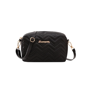 Women's black quilted crossbody camera bag with wave patterns and golden logo hardware
