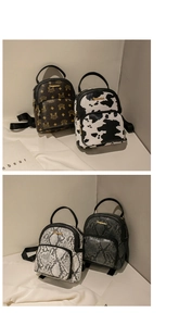 Detailed view of mini backpacks in cow print and faux leather textures with metal logo