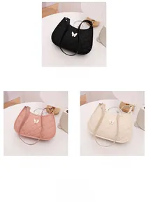 Three variants of butterfly shoulder bags in black, pink, and white with quilted pattern