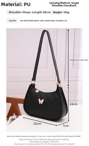 Detailed view of black quilted PU leather shoulder bag with butterfly charm and dimensions