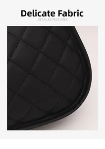 Close-up of black quilted leather texture and delicate sewing on butterfly crescent bag