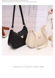Close-up of small quilted shoulder bags with butterfly accents in black and beige