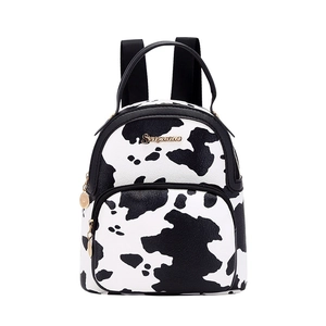 Cow print mini backpack in black and white PU leather with gold zipper details