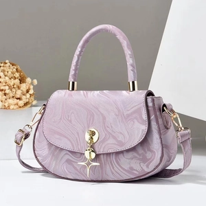 Elegant purple marble pattern handbag with golden star hardware and top handle strap