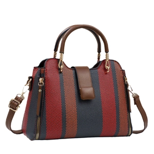 Sac à main en toile à rayures tricolores avec bordure en cuir marron et bandoulière