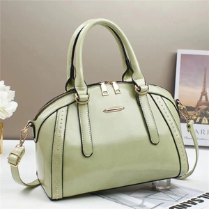 Chic pistachio green leather Boston bag with elegant gold hardware and top handles