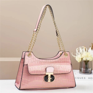 Pale pink faux crocodile leather handbag with elegant gold chain and metal lock closure