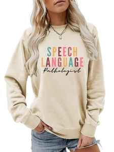 Detail of the colorful SPEECH LANGUAGE Pathologist print on a beige crewneck sweatshirt
