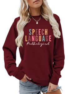 Close-up of burgundy crew neck sweatshirt featuring speech language pathologist print