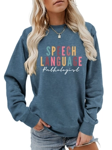 Close-up of Speech Language Pathologist print on navy blue crewneck sweatshirt fabric