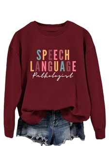 Detail of burgundy sweatshirt featuring SPEECH LANGUAGE Pathologist colorful embroidery