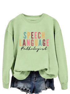 Detail of light green sweatshirt with Speech Language Pathologist colorful typography