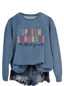 Detail view of blue crewneck sweatshirt featuring SPEECH LANGUAGE PATHOLOGIST print design