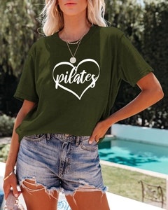 Detail of dark olive green Pilates heart print t-shirt with cotton texture and crew neck