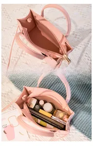 Pink crocodile pattern tote bag interior with multi-compartment storage and zipper pocket