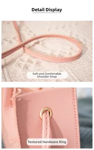Detailed close-up of pink leather handbag showing soft strap and gold metal hardware