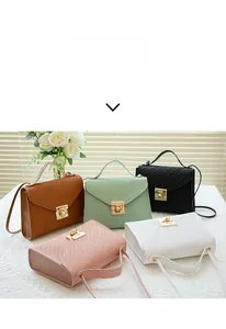 Detail showing five colors of V-shaped envelope bags with woven texture and gold metal clasp