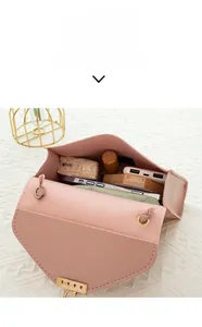Capacity display of the small pink PU leather crossbody bag showing daily essentials