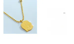 Detail of 18K gold plated bead chain with 'Good Luck' engraved smiley face square pendant