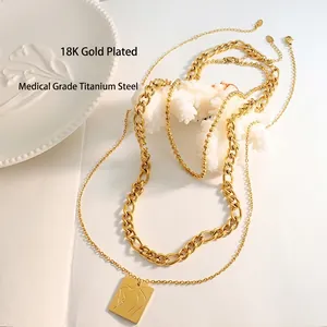 Layered 18K gold plated titanium necklaces with abstract female figure rectangular pendant