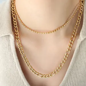Double-layered gold curb chain and bead necklace for women with abstract geometric charms