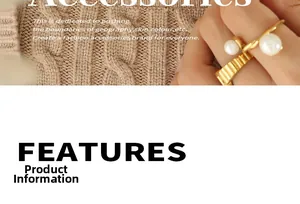 Close-up of a gold spiral open ring with two white pearls on a soft knit sweater