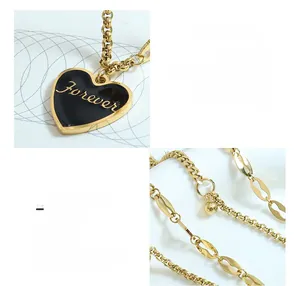 Detail of 18K gold plated titanium steel necklace with black heart pendant and Forever text