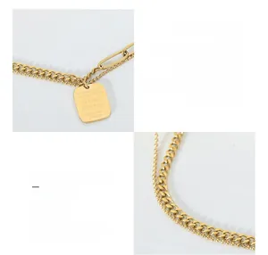 Detail of layered gold titanium necklace featuring cuba chains and engraved square pendant