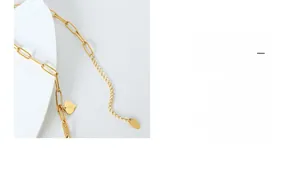 Detail of 18K gold heart pendant necklace with adjustable chain and K18 hallmark