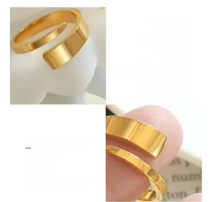 Close-up of a twisted 18K gold plated titanium steel ring showing its smooth texture