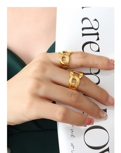 Detail of hollow cuban chain ring in 18k gold plated titanium steel on fingers