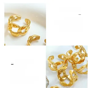 Macro detail of 18K gold plated Cuban link titanium steel ring with adjustable opening
