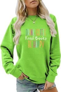 Detail of neon green sweatshirt featuring colorful Drink Coffee Read Books art print