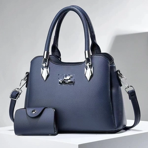 Navy blue faux leather tote bag set with pebble texture and adjustable shoulder strap