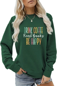 Detail of ribbed cuffs and vibrant Drink Coffee typography on green sweatshirt