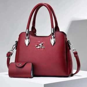 Litchi pattern red leather handbag and matching coin purse set with silver hardware