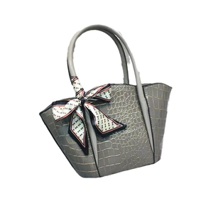 Grey crocodile embossed tote bag with stylish geometric pattern scarf on handle
