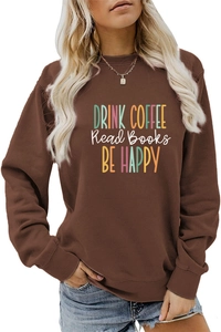 Detail of DRINK COFFEE typography print on a brown long-sleeve casual sweatshirt