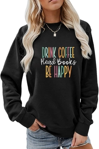 Detail of DRINK COFFEE BE HAPPY text print on black crewneck long sleeve sweatshirt