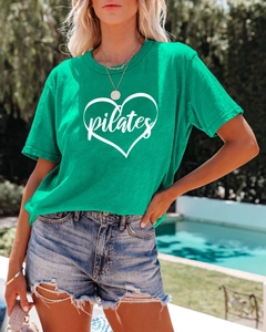 Detail of green Pilates heart print cotton t-shirt with subtle slub texture fabric
