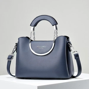 Minimalist dark blue litchi grain leather handbag with silver metal handles and strap