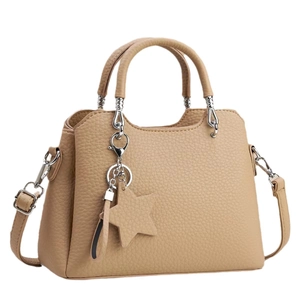 Minimalist khaki leather tote bag with star pendant and detachable shoulder strap
