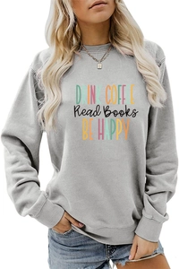 Close-up of grey sweatshirt featuring colorful Drink Coffee and Be Happy printed text