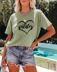 Detail of avocado green cotton Pilates T-shirt with heart print and crew neck